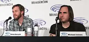 Aaron Horvath and Michael Jelenic speaking during a WonderCon panel for "Teen Titans Go!" in 2016