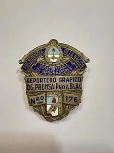 Chapa de acreditación como reportero gráfico
