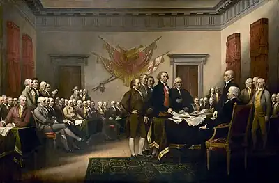 Declaración de Independencia de John Trumbull, 1817. Presentación al Congreso Continental por la comisión de los «cinco hombres» de la propuesta de Declaración de Independencia de los Estados Unidos (4 de julio de 1776). Aparecen entre otros Thomas Jefferson, Benjamin Franklin, John Adams y James Wilson. En este texto se aplicaron los valores de la Ilustración a la construcción del primer sistema político contemporáneo. La recepción de esta experiencia en Europa, principalmente en Francia, fue una mezcla de simpatía y paternalismo: el mito del buen salvaje contribuyó a ello, y también la habilidad diplomática del propio Franklin, embajador en París. Los estadounidenses se presentaron a sí mismos como resistentes a la tiranía, con referencias neoclásicas a la antigua República Romana, de la que se verán herederos de allí en adelante (Nueva Roma)