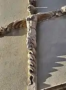 Término en forma de sirena extendiendo sus alas.